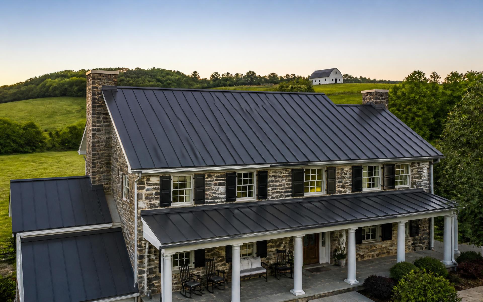 Standing seam metal roof panels on a completed premium roofing project